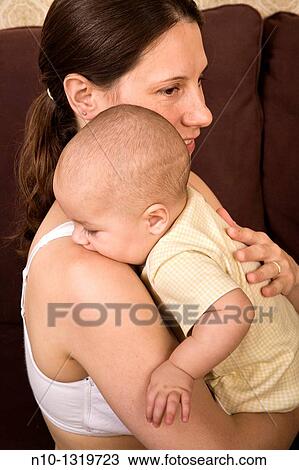 Stock Image - Mother with her six-month old son. Fotosearch