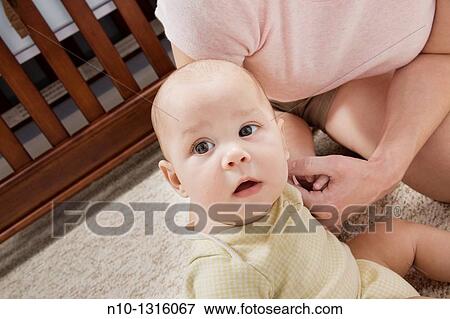 Mother with her six-month old son View Large Photo Image Stock Photo - Mother with her six-month old son. Fotosearch