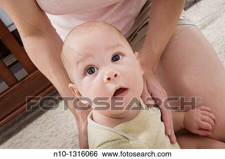 Mother with her six-month old son View Large Photo Image Stock Photograph - Mother with her six-month old son. Fotosearch