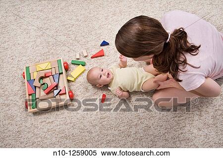 Mother with her six-month old son View Large Photo Image Stock Photography - Mother with her six-month old son. Fotosearch
