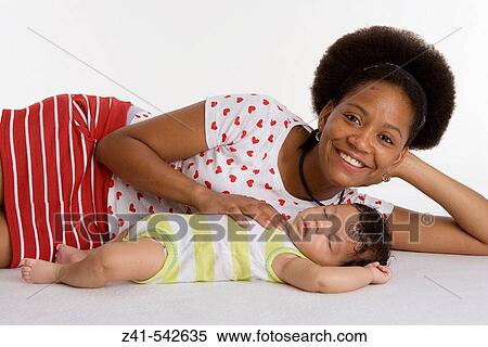 Mother with her sleeping baby. View Large Photo Image Stock Photography - Mother with her sleeping baby.. Fotosearch