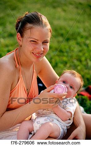 Mother with infant baby View Large Photo Image Stock Photograph - Mother with infant baby. Fotosearch