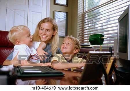 mother with kids in a home office View Large Photo Image Stock Photo - mother with kids in a home office. Fotosearch