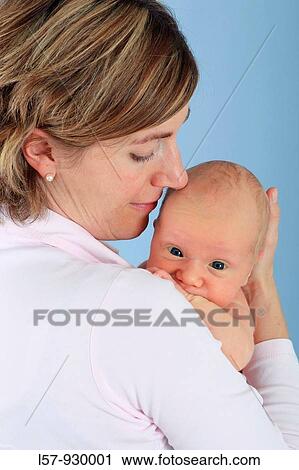 mother with new born baby child, Studio shot View Large Photo Image Stock Image - mother with new born baby child, Studio shot. Fotosearch
