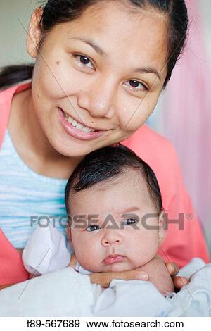 Mother with new born child View Large Photo Image Stock Photo - Mother with new born child. Fotosearch