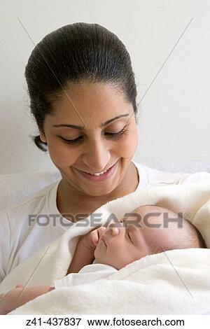 Stock Photo - Mother with newborn baby. Fotosearch