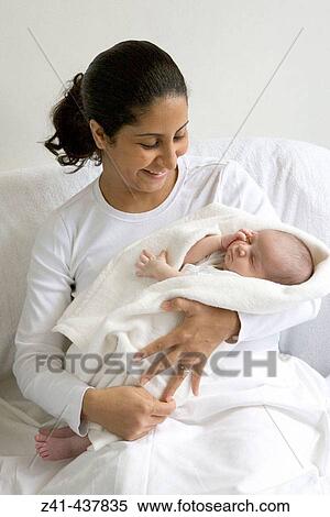 Stock Photography - Mother with newborn baby. Fotosearch