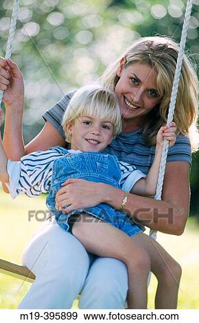 mother with son on a swing View Large Photo Image Stock Photo - mother with son on a swing. Fotosearch