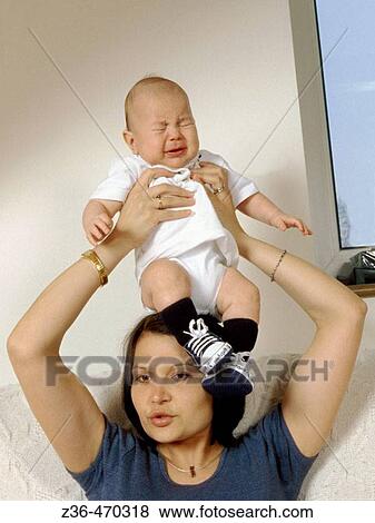 Stock Photo - Mother with son on head. Fotosearch