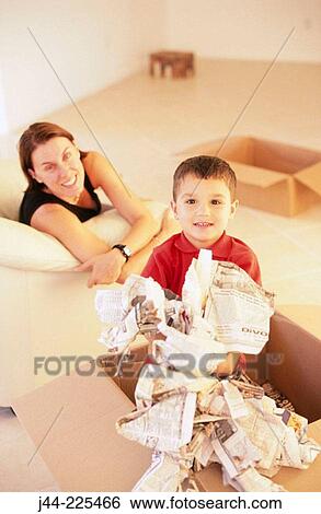 Mother with son playing with moving boxes View Large Photo Image Stock Photograph - Mother with son playing with moving boxes. Fotosearch