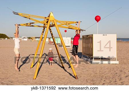 Mother with Teenage Boy Swinging Together on P? rnu Pier, Estonia View Large Photo Image Stock Image - Mother with Teenage Boy Swinging Together on P? rnu Pier, Estonia. Fotosearch