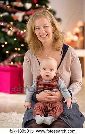 Mother with their six month year old baby at Christmas View Large Photo Image Stock Photography - Mother with their six month year old baby at Christmas. Fotosearch