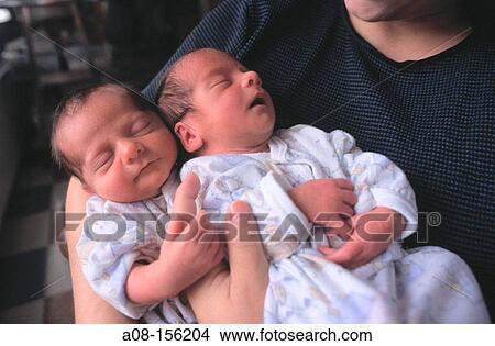 Mother with twin newborn babies View Large Photo Image Picture - Mother with twin newborn babies. Fotosearch