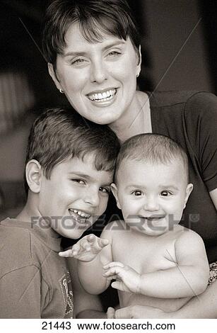 Mother with two young sons portrait smiling View Large Photo Image Stock Image - Mother with two young sons portrait smiling. Fotosearch