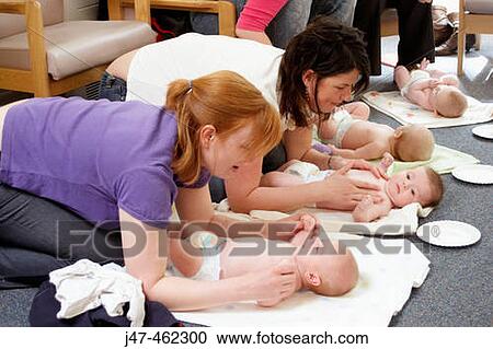 Mothers and babies in a baby massage class View Large Photo Image Stock Image - Mothers and babies in a baby massage class. Fotosearch