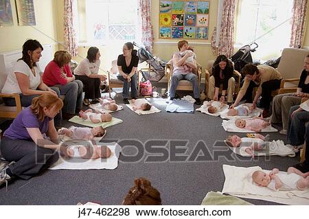 Mothers and babies in a baby massage class View Large Photo Image Stock Photo - Mothers and babies in a baby massage class. Fotosearch