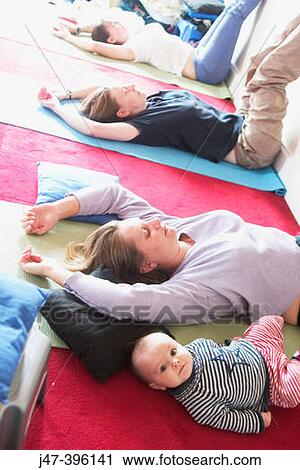 Mothers in post natal yoga class with their babies View Large Photo Image Stock Image - Mothers in post natal yoga class with their babies. Fotosearch