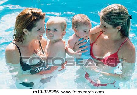 Mothers with babies in the swimming pool View Large Photo Image Stock Photograph - Mothers with babies in the swimming pool. Fotosearch