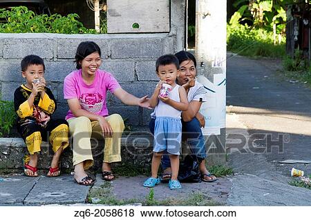 Stock Photo - Mothers with Children in Jimbaran on Bali, Indonesia.. Fotosearch
