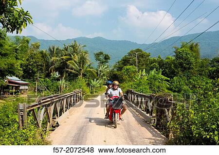 Motorbike rental in Vang Vieng, Laos. View Large Photo Image Stock Photo - Motorbike rental in Vang Vieng, Laos.. Fotosearch
