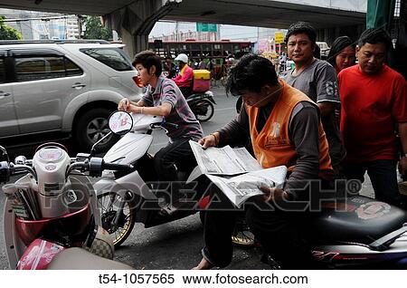 Stock Photography - Motorbike Taxi Driver waiting for Customers. Fotosearch