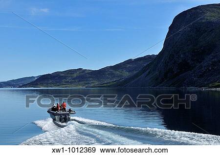 motorboat cruising through Saglek Fjord, Torngat Mountains National Park, Newfoundland and Labrador, Canada View Large Photo Image Stock Photo - motorboat cruising through Saglek Fjord, Torngat Mountains National Park, Newfoundland and Labrador, Canada. Fotosearch