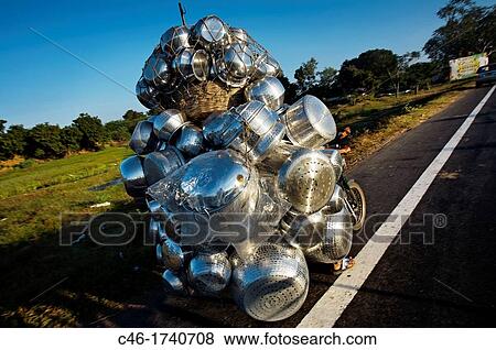 Motorcycle carrying casseroles, Pondicherry, Tamil Nadu, India. View Large Photo Image Stock Photo - Motorcycle carrying casseroles, Pondicherry, Tamil Nadu, India.. Fotosearch