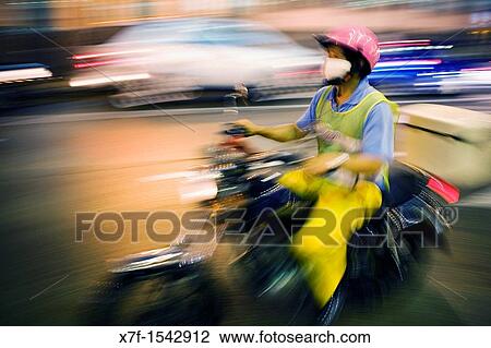 Motorcycle in Praia Grande Avenue, Macau, China View Large Photo Image Stock Image - Motorcycle in Praia Grande Avenue, Macau, China. Fotosearch