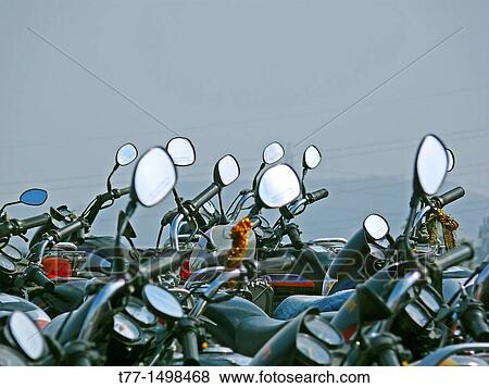Motorcycles, bikes are parked at office place View Large Photo Image Stock Photo - Motorcycles, bikes are parked at office place. Fotosearch