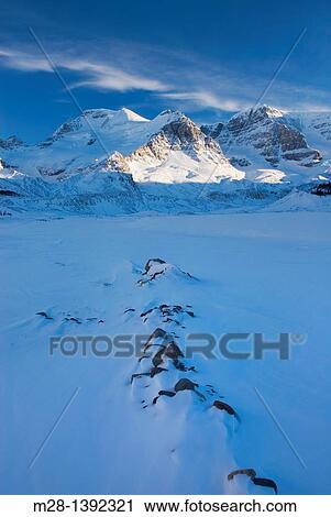 Stock Image - Mount Athabasca and Mount Andromeda in winter seen from the glacial plain of the SunwaptaRiver, Jasper National Park Alberta Canada. Fotosearch