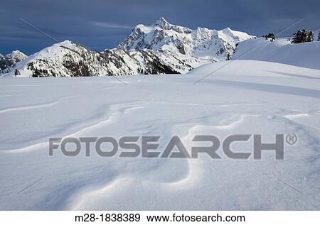 Mount Shuksan, 9, 131 ft 2, 783 m, with patterns of windblown snow or sastrugi in the foreground, North Cascades Washington View Large Photo Image Stock Photo - Mount Shuksan, 9, 131 ft 2, 783 m, with patterns of windblown snow or sastrugi in the foreground, North Cascades Washington. Fotosearch