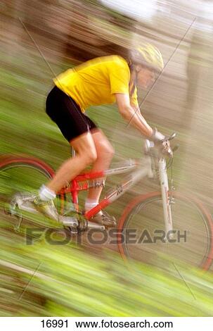Mountain biker blurred through forest View Large Photo Image Stock Image - Mountain biker blurred through forest. Fotosearch
