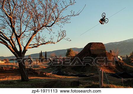 Mountain Biker Danny Pace doing a frontlfip over a jump in California. View Large Photo Image Stock Image - Mountain Biker Danny Pace doing a frontlfip over a jump in California.. Fotosearch