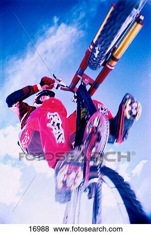 Mountain biker jumping over viewer View Large Photo Image Stock Photo - Mountain biker jumping over viewer. Fotosearch