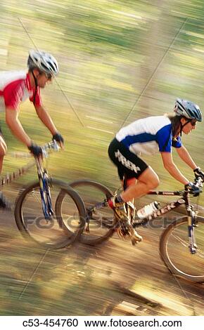 Mountain biker riding fast in forest at Deer Valley. Utah, USA View Large Photo Image Stock Image - Mountain biker riding fast in forest at Deer Valley. Utah, USA. Fotosearch