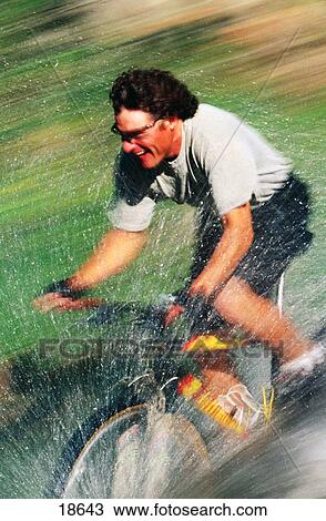 Mountain biker riding through stream View Large Photo Image Stock Image - Mountain biker riding through stream. Fotosearch