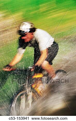 Mountain biking in stream View Large Photo Image Stock Image - Mountain biking in stream. Fotosearch