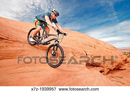 Mountain biking The Slickrock Trail on sandstone of the Colorado Plateau near the city of Moab in southern Utah. View Large Photo Image Stock Photo - Mountain biking The Slickrock Trail on sandstone of the Colorado Plateau near the city of Moab in southern Utah.. Fotosearch