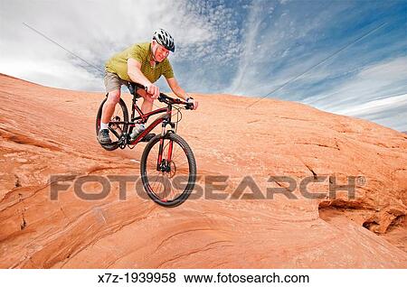 Mountain biking The Slickrock Trail on sandstone of the Colorado Plateau near the city of Moab in southern Utah. View Large Photo Image Stock Photo - Mountain biking The Slickrock Trail on sandstone of the Colorado Plateau near the city of Moab in southern Utah.. Fotosearch