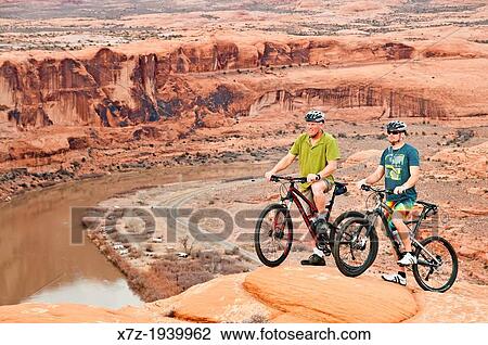 Mountain biking The Slickrock Trail high above the Colorado River and near the city of Moab in southern Utah. View Large Photo Image Stock Image - Mountain biking The Slickrock Trail high above the Colorado River and near the city of Moab in southern Utah.. Fotosearch