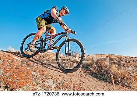 Mountain biking the Upper Sugarloaf Trail at Indian Springs in the Goose Creek Mountains in southern Idaho View Large Photo Image Stock Photograph - Mountain biking the Upper Sugarloaf Trail at Indian Springs in the Goose Creek Mountains in southern Idaho. Fotosearch