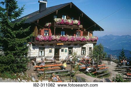 Stock Image - Mountain Hut on top of Pendling Mountain near Kufstein, Austria by the river Inn Valley offering traditional food and drinks with a panoramic mountain view. Fotosearch