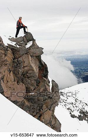 Mountaineer in snowy mountain View Large Photo Image Stock Photo - Mountaineer in snowy mountain. Fotosearch