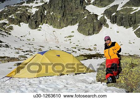 Mountaineer next to the yellow tent in the Sierra de B? jar Natural Park, in Salamanca province, Biosphere Reserve of Sierra de B? jar and Francia View Large Photo Image Stock Image - Mountaineer next to the yellow tent in the Sierra de B? jar Natural Park, in Salamanca province, Biosphere Reserve of Sierra de B? jar and Francia. Fotosearch