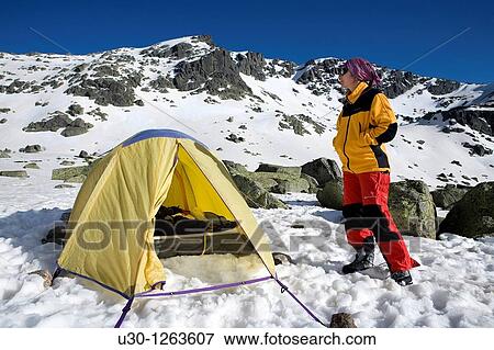 Stock Photo - Mountaineer next to the yellow tent in the Sierra de B? jar Natural Park, in Salamanca province, Biosphere Reserve of Sierra de B? jar and Francia. Fotosearch