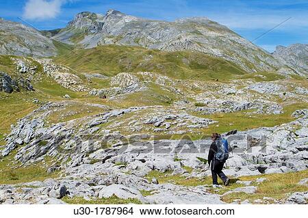 Mountaineer walking in National Park des Pyrenees, in Bearn province Atlantics Pyrenees Aquitania, France Europe View Large Photo Image Picture - Mountaineer walking in National Park des Pyrenees, in Bearn province Atlantics Pyrenees Aquitania, France Europe. Fotosearch