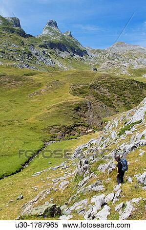 Mountaineer walking in National Park des Pyrenees, in Bearn province Atlantics Pyrenees Aquitania, France Europe View Large Photo Image Stock Photography - Mountaineer walking in National Park des Pyrenees, in Bearn province Atlantics Pyrenees Aquitania, France Europe. Fotosearch