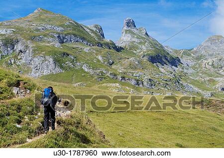 Mountaineer walking near Midi D? Ossau peak, in National Park des Pyrenees, in Bearn province Atlantics Pyrenees Aquitania, France Europe View Large Photo Image Stock Image - Mountaineer walking near Midi D? Ossau peak, in National Park des Pyrenees, in Bearn province Atlantics Pyrenees Aquitania, France Europe. Fotosearch