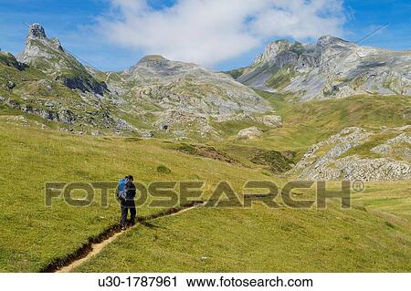 Mountaineer walking near Midi D? Ossau peak, in National Park des Pyrenees, in Bearn province Atlantics Pyrenees Aquitania, France Europe View Large Photo Image Stock Image - Mountaineer walking near Midi D? Ossau peak, in National Park des Pyrenees, in Bearn province Atlantics Pyrenees Aquitania, France Europe. Fotosearch