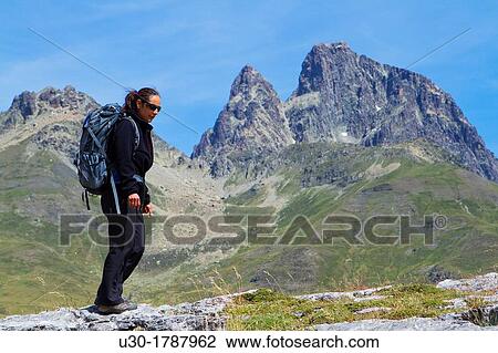 Mountaineer walking near Midi D? Ossau peak, in National Park des Pyrenees, in Bearn province Atlantics Pyrenees Aquitania, France Europe View Large Photo Image Stock Image - Mountaineer walking near Midi D? Ossau peak, in National Park des Pyrenees, in Bearn province Atlantics Pyrenees Aquitania, France Europe. Fotosearch